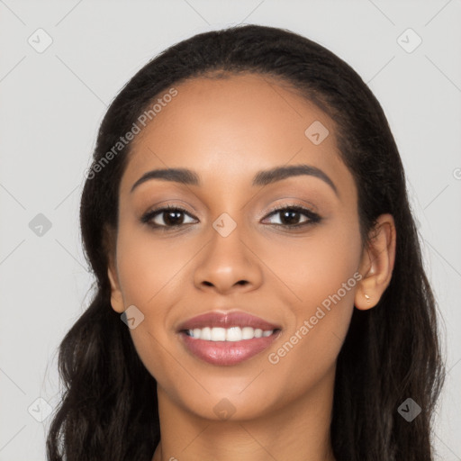 Joyful latino young-adult female with long  black hair and brown eyes