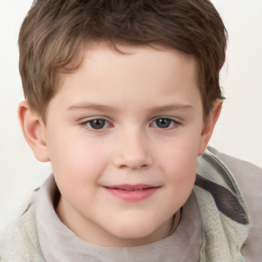 Joyful white child male with short  brown hair and brown eyes