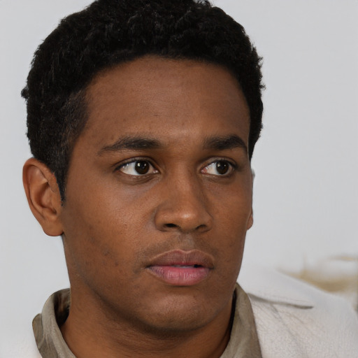Neutral black young-adult male with short  brown hair and brown eyes