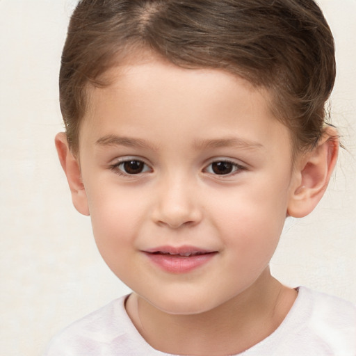 Joyful white child male with short  brown hair and brown eyes