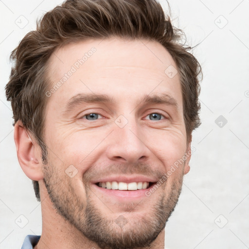 Joyful white adult male with short  brown hair and grey eyes