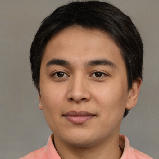 Joyful asian young-adult male with short  brown hair and brown eyes