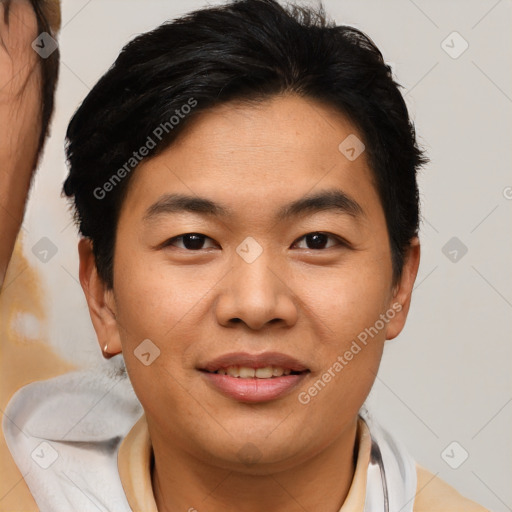 Joyful asian young-adult male with short  brown hair and brown eyes