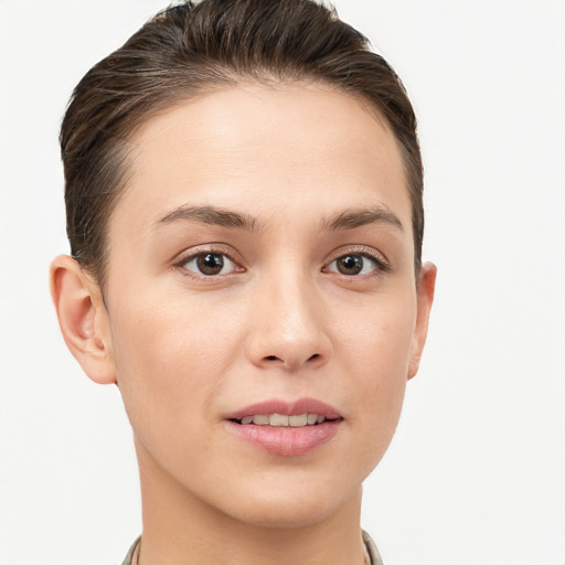 Joyful white young-adult female with short  brown hair and brown eyes