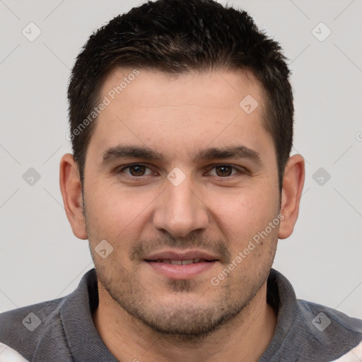 Joyful white young-adult male with short  brown hair and brown eyes