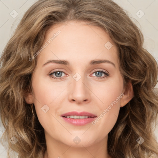 Joyful white young-adult female with long  brown hair and green eyes