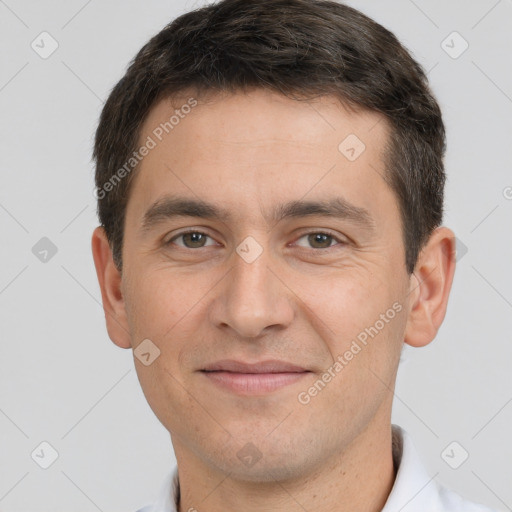 Joyful white young-adult male with short  brown hair and brown eyes