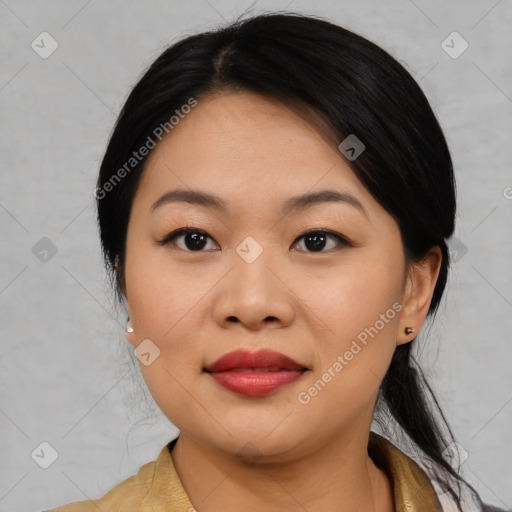 Joyful asian young-adult female with medium  black hair and brown eyes