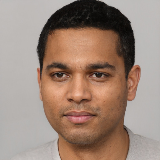 Neutral latino young-adult male with short  black hair and brown eyes