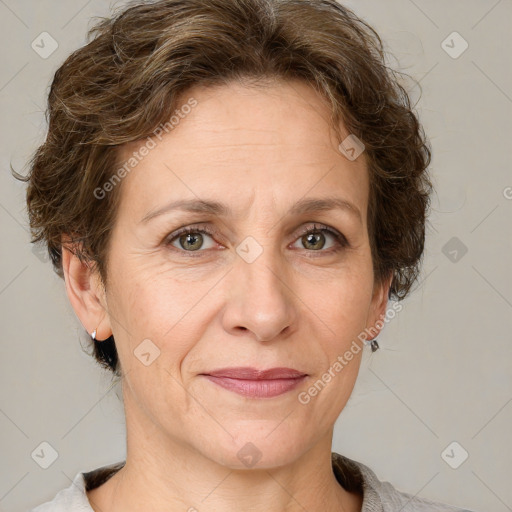 Joyful white adult female with short  brown hair and grey eyes