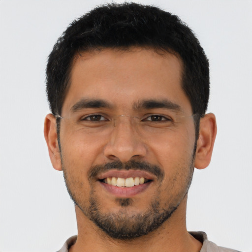 Joyful asian young-adult male with short  black hair and brown eyes