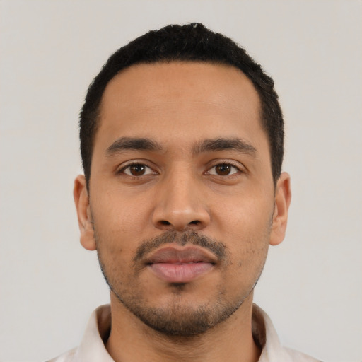 Neutral latino young-adult male with short  black hair and brown eyes