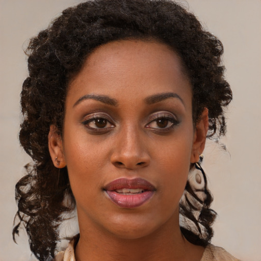 Neutral black young-adult female with medium  brown hair and brown eyes