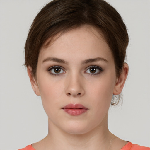 Neutral white young-adult female with short  brown hair and brown eyes