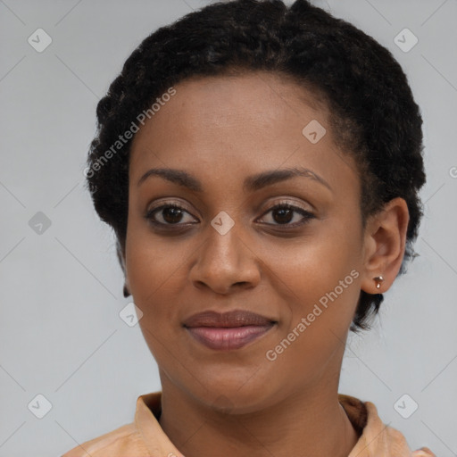 Joyful black young-adult female with short  brown hair and brown eyes