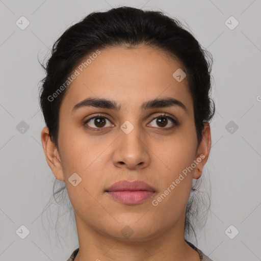 Joyful latino young-adult female with medium  brown hair and brown eyes