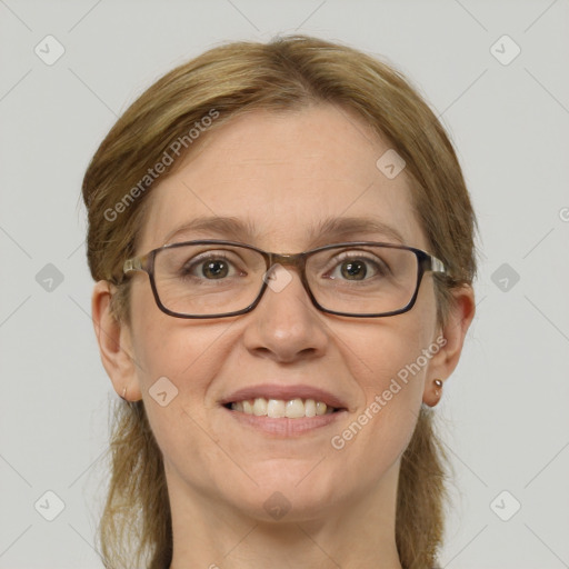 Joyful white adult female with medium  brown hair and grey eyes