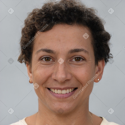 Joyful white adult female with short  brown hair and brown eyes