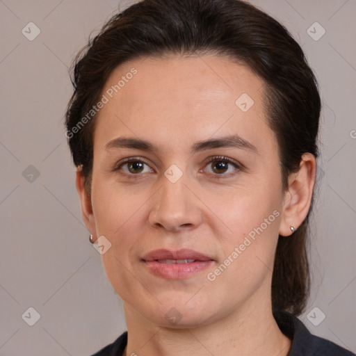 Joyful white adult female with medium  brown hair and brown eyes