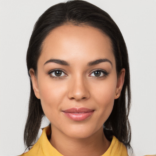 Joyful latino young-adult female with medium  black hair and brown eyes