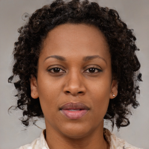 Neutral black young-adult female with medium  brown hair and brown eyes