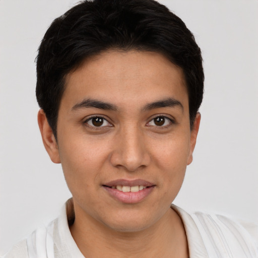 Joyful latino young-adult male with short  brown hair and brown eyes