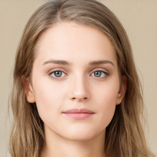 Neutral white young-adult female with long  brown hair and green eyes