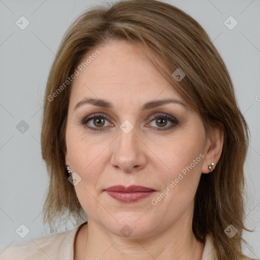 Joyful white adult female with medium  brown hair and brown eyes