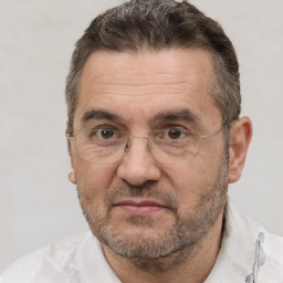 Joyful white middle-aged male with short  brown hair and brown eyes