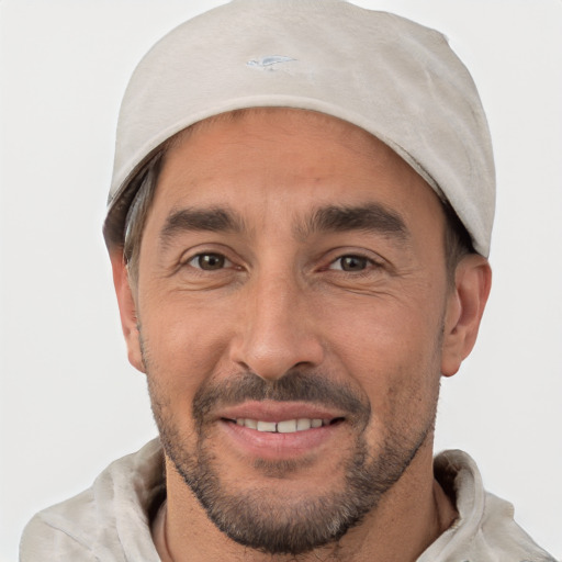 Joyful white adult male with short  brown hair and brown eyes