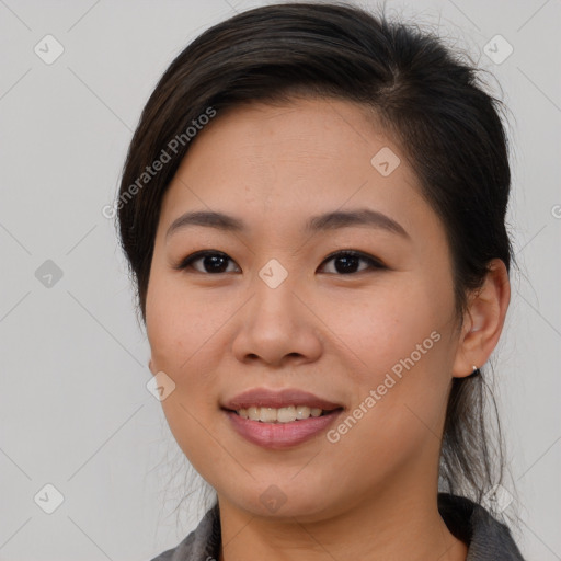 Joyful asian young-adult female with medium  brown hair and brown eyes