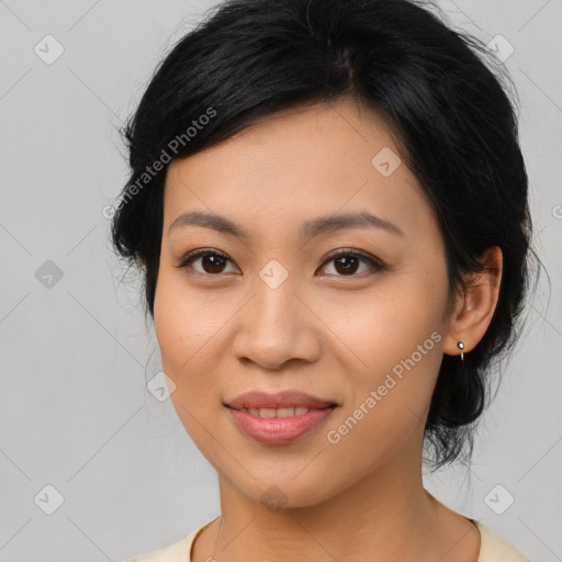 Joyful asian young-adult female with medium  black hair and brown eyes