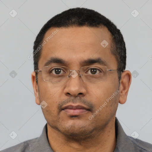 Neutral latino adult male with short  black hair and brown eyes