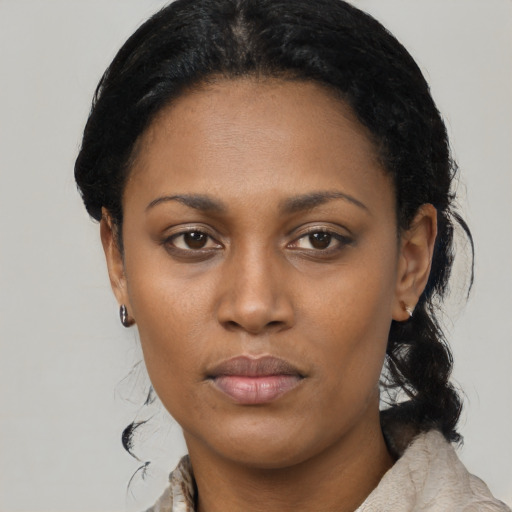 Neutral black young-adult female with medium  black hair and brown eyes