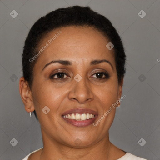 Joyful black adult female with short  brown hair and brown eyes