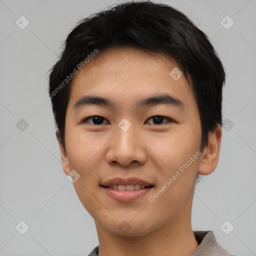 Joyful asian young-adult male with short  black hair and brown eyes