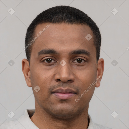 Neutral latino young-adult male with short  black hair and brown eyes