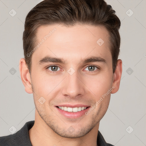 Joyful white young-adult male with short  brown hair and brown eyes