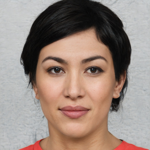 Joyful asian young-adult female with medium  black hair and brown eyes