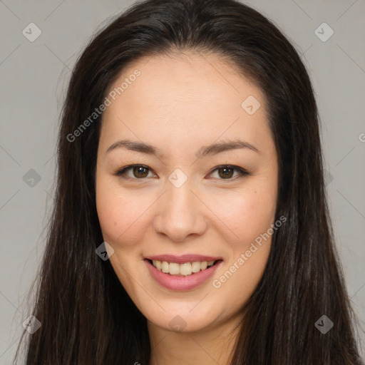 Joyful asian young-adult female with long  brown hair and brown eyes