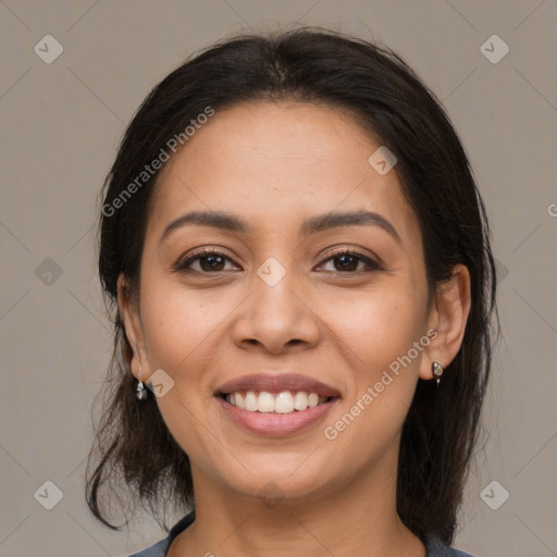 Joyful latino young-adult female with medium  brown hair and brown eyes