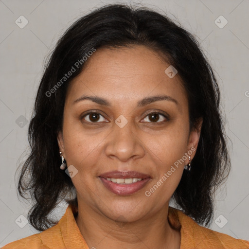 Joyful black adult female with medium  brown hair and brown eyes