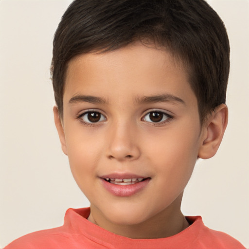 Joyful white child male with short  brown hair and brown eyes