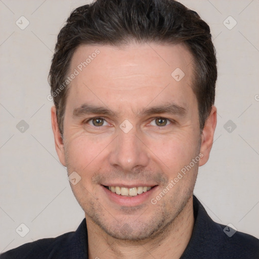 Joyful white adult male with short  brown hair and brown eyes