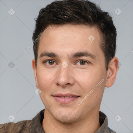 Joyful white young-adult male with short  brown hair and brown eyes