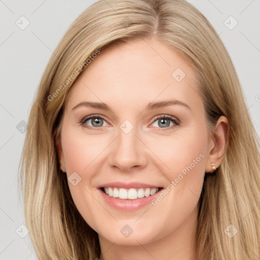 Joyful white young-adult female with long  brown hair and blue eyes