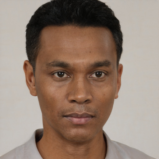 Neutral black young-adult male with short  black hair and brown eyes