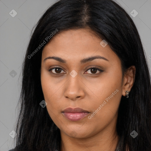 Joyful latino young-adult female with long  brown hair and brown eyes