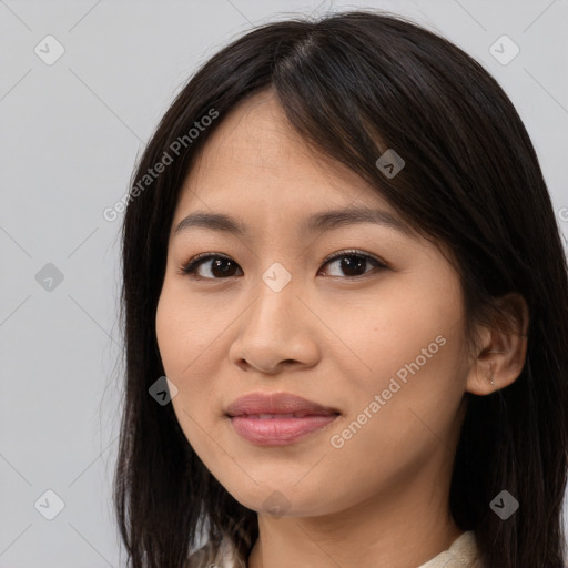 Joyful asian young-adult female with long  brown hair and brown eyes