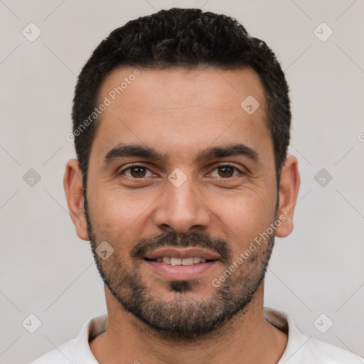 Joyful white young-adult male with short  black hair and brown eyes